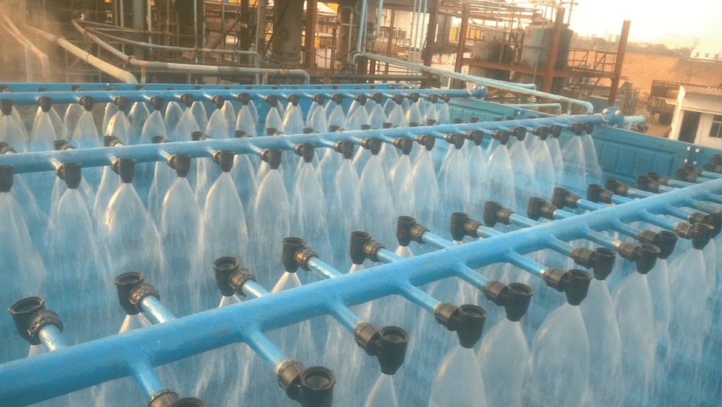 Cooling tower spray system